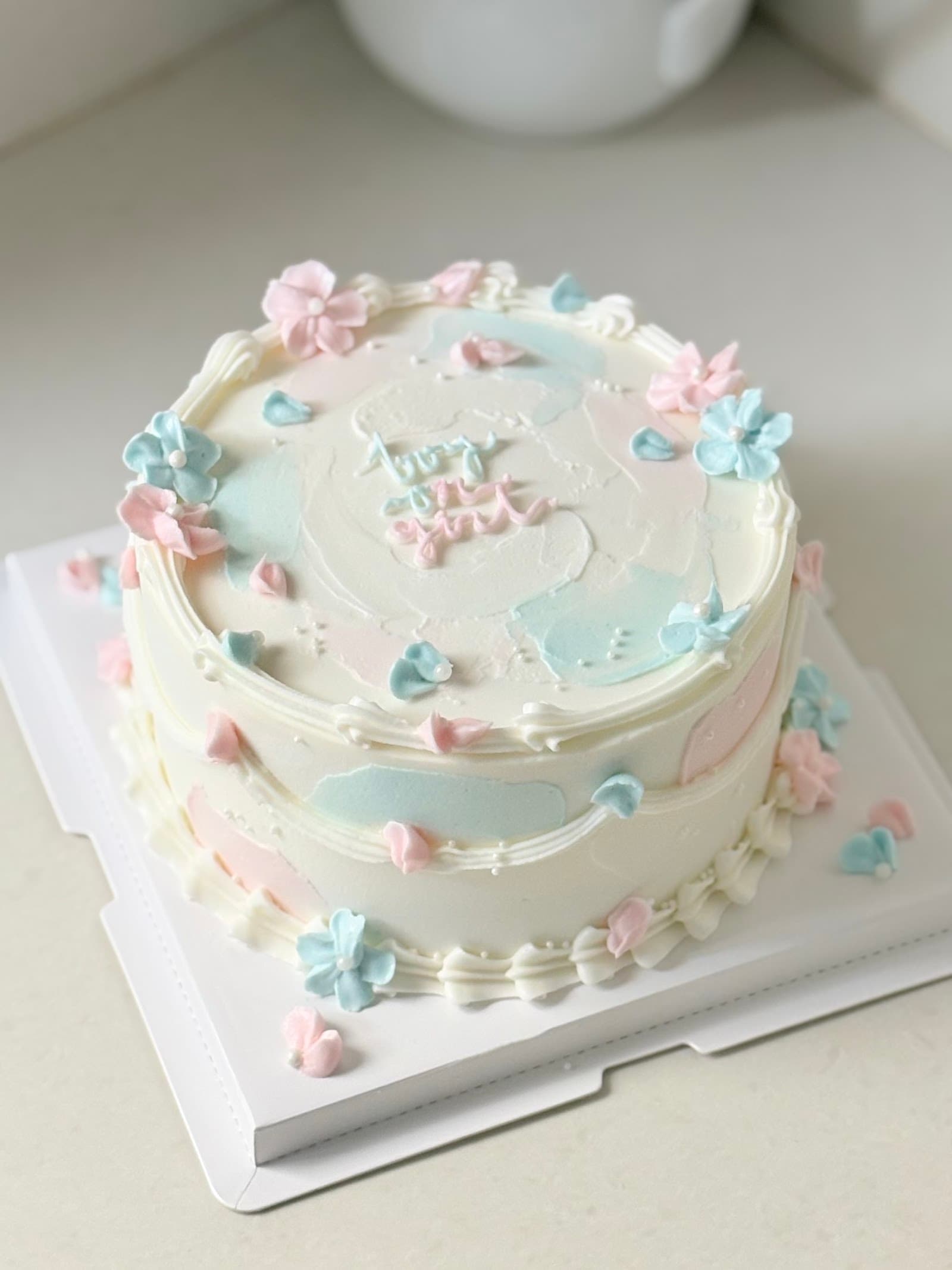 Gender reveal buttercream cake with candles